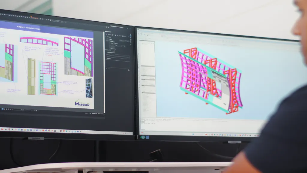 Dual monitor CAD software displaying a 3D brick facade rail model for project coordination