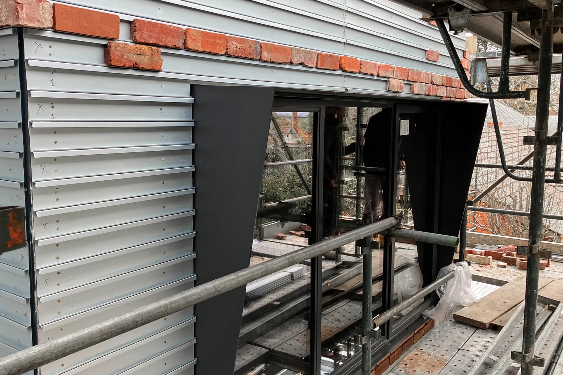 Real brick facade coursing installed above an aluminium window during a Surrey Hills renovation