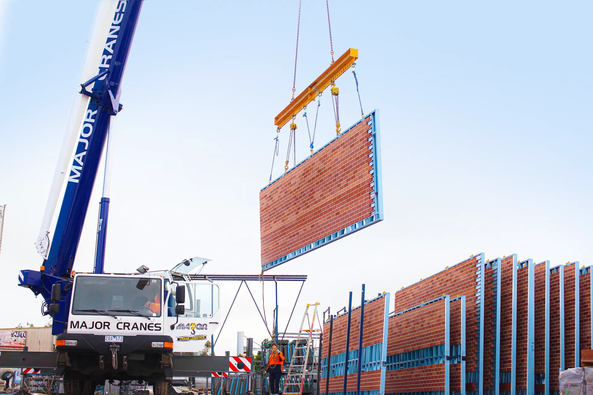 Major Cranes lifting a prefabricated real brick facade panel at the Modular Masonry yard