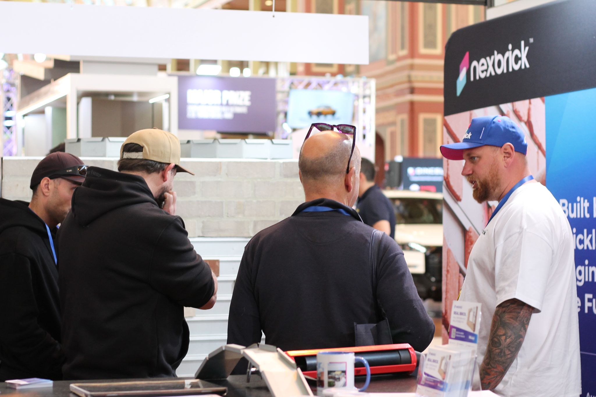 Visitors discussing Nexbrick with the team